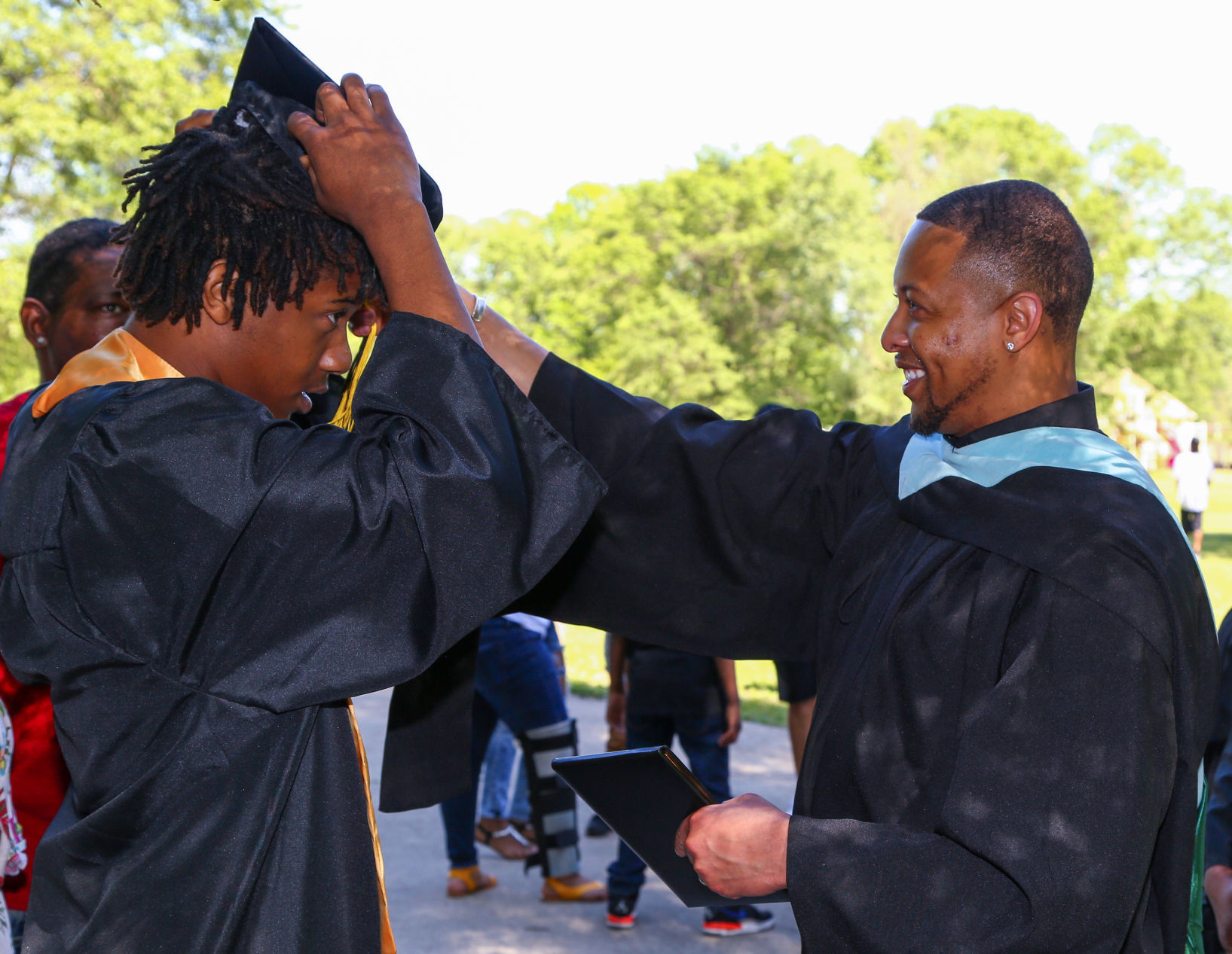 The last graduating class from Roosevelt College and Career Academy graduates
